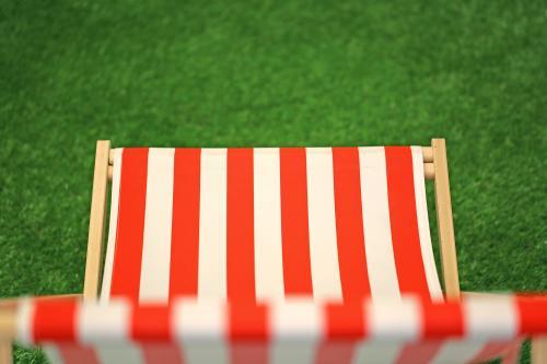 Top view of a red and white canvass lawn chair