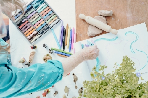 Top view of women with art materials