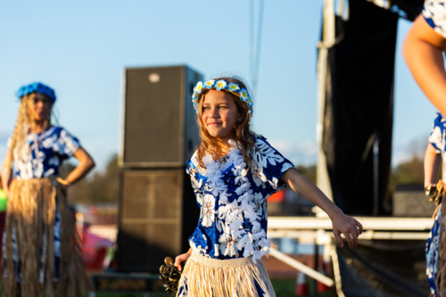 Torres Strait Islander child dancing and performing traditional dance at cultural spectacular event - Australian Stock Image