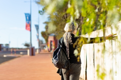 tourist wandering the  streets of small goldfields town - Australian Stock Image