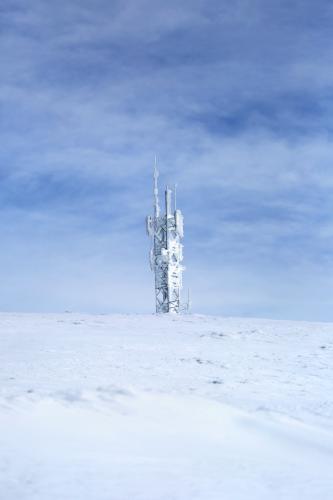 Tower on snow covered mountain