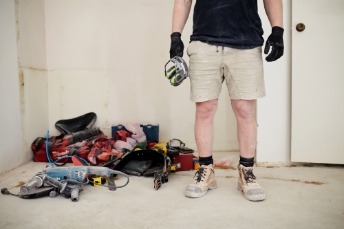 Tradesman standing in front of tools - Australian Stock Image