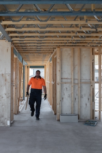 Tradie at work on house building site - Australian Stock Image