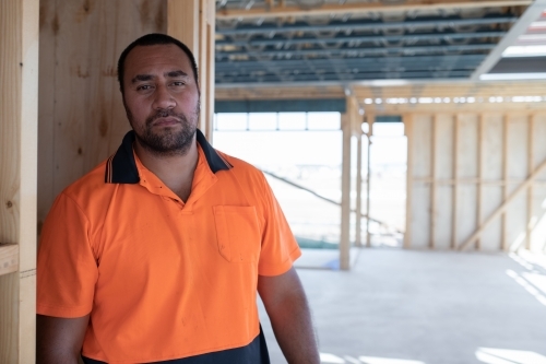 Tradie at work on house building site - Australian Stock Image