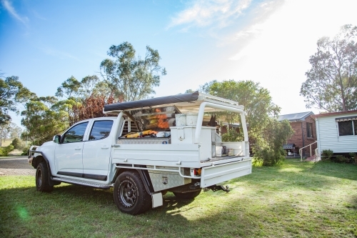 Tradies ute on property with kelpie dog sitting on tray - Australian Stock Image