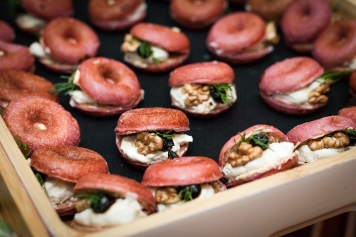 Tray of mini beetroot donuts and filling - Australian Stock Image