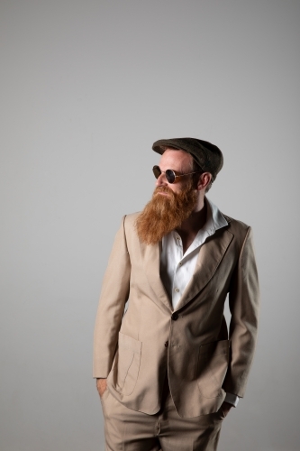 Trendy man with ginger beard and flat cap