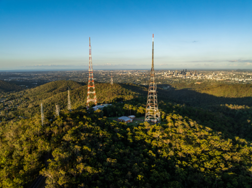 TV towers on hill with Brisbane City behind - Australian Stock Image