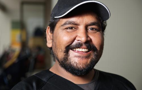 Twenty five Year Old Aboriginal Man Smiling Broadly - Australian Stock Image