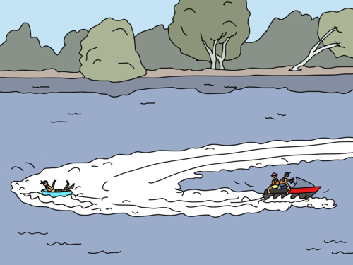 Two adults on jetski towing child on tube on river - Australian Stock Image