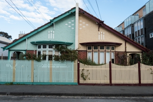 Two attached houses painted in two different colours
