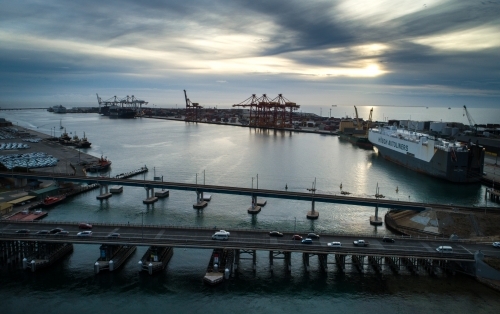 Two bridges linking a port over a body of water. - Australian Stock Image