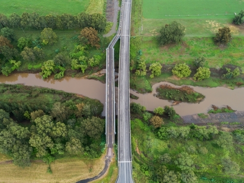 Two bridges over muddy hunter river, car bridge and foot bridge