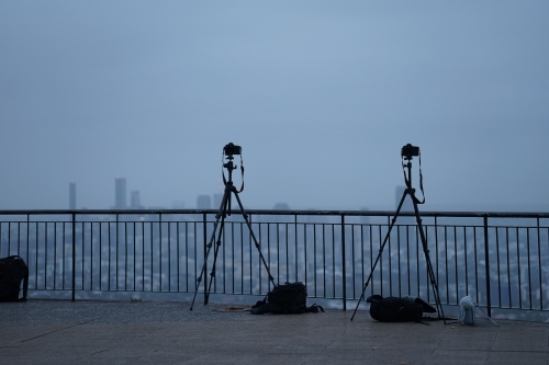 Two cameras set up for cloudy sunrise shot