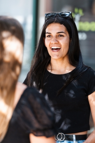 two friends chatting - Australian Stock Image