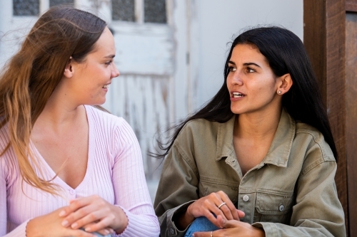 two friends chatting - Australian Stock Image