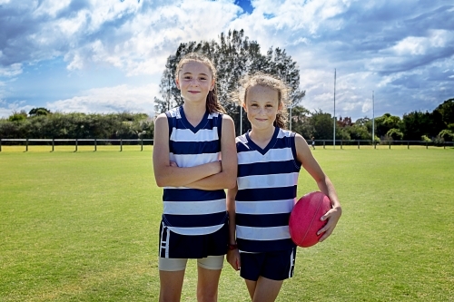 Two girl team players in AFL football - Australian Stock Image
