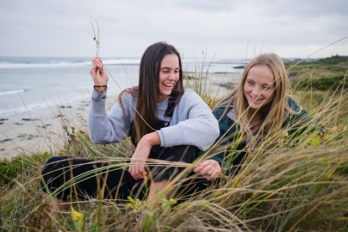 Two girls in their twenties laughing and happy - Australian Stock Image