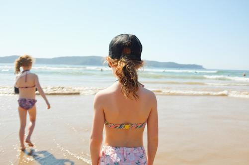 Two girls looking out at the ocean - Australian Stock Image