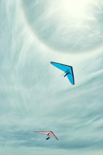 two gliders flying with a sun halo on a summer's day - Australian Stock Image