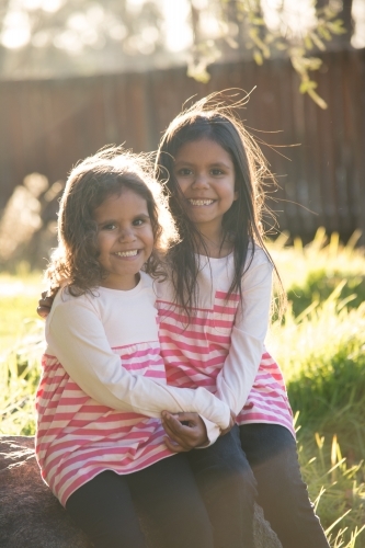 Two happy Aboriginal girl sisters - Australian Stock Image