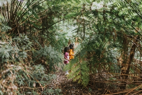 Two little girls in the forest