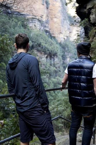Two men on bush walk looking at scenery - Australian Stock Image