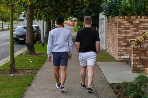 two men walking on the footpath - Australian Stock Image