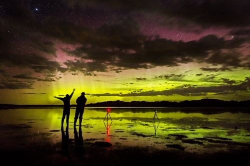 two photographers shooting aurora australis