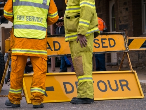 Two rural fire service men manning a detour sign - Australian Stock Image