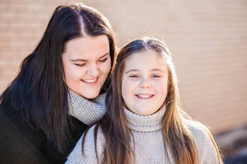 Two sisters laughing together - Australian Stock Image