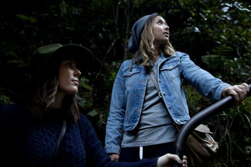 Two women holding handrail on bush walk - Australian Stock Image