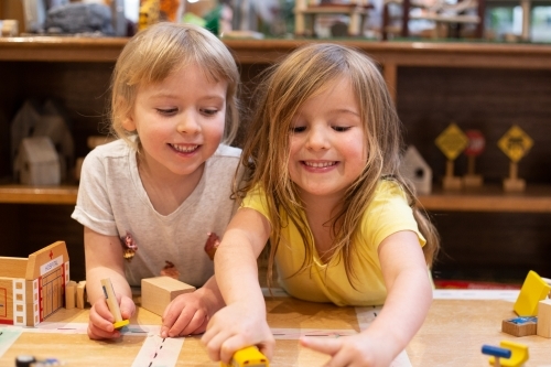 Two young girl friends playing - Australian Stock Image