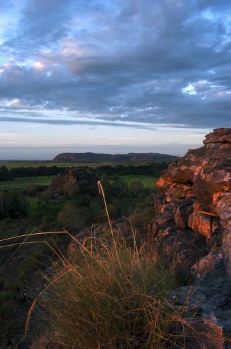 Ubirr Rock Kakadu at sunset with dark clouds - Australian Stock Image