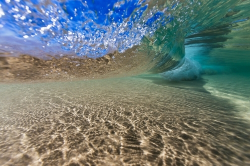 Underwater image of a breaking wave in clear water
