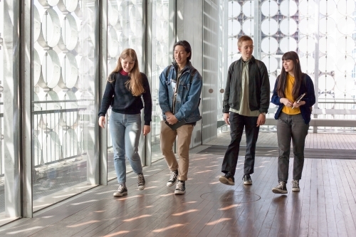 University students walking through a building on campus - Australian Stock Image