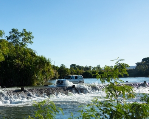 vehicle crossing the flooded Ivanhoe crossing near Kununurra - Australian Stock Image