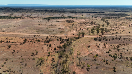 Vehicle parked in the middle of an outback dirt road - Australian Stock Image