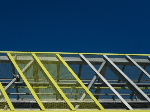 Veloway architecture besides pacific motorway with blue skies