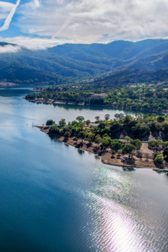 Vertical Aerial view of Glenbawn Dam and camping areas along the shoreline - Australian Stock Image