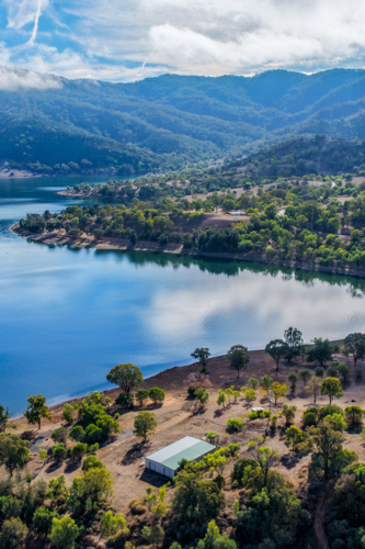Vertical Aerial view of Glenbawn Dam and camping areas along the shoreline - Australian Stock Image