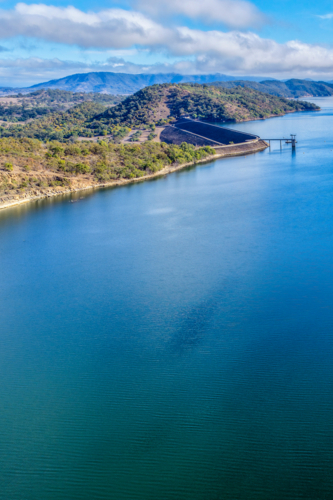 Vertical Aerial view of the Glenbawn Dam wall and surrounding landscape - Australian Stock Image