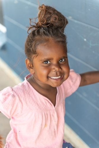 Vertical shot of 3 year old Aboriginal girl - Australian Stock Image