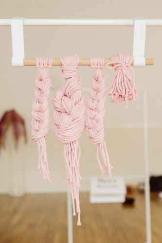 Vertical shot of braided hanging yarn