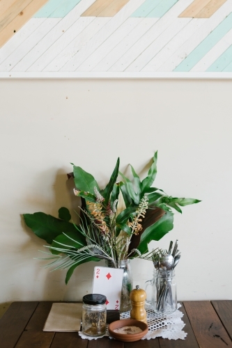 Vertical shot of greenery display on café table - Australian Stock Image
