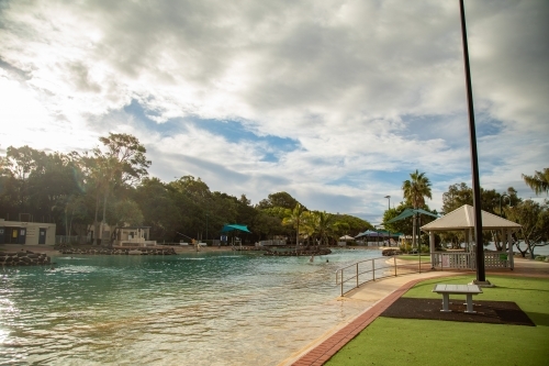 Vibrant afternoon at the Settlement Cove Lagoon swimming pool in Redcliffe, Queensland Australia - Australian Stock Image