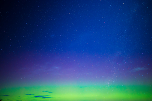 vibrant green and purple aurora night sky - Australian Stock Image
