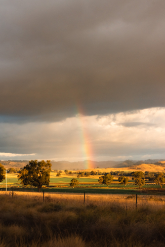 Vibrant rainbow in rural New South Wales - Australian Stock Image