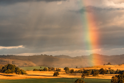 Vibrant rainbow in rural New South Wales - Australian Stock Image
