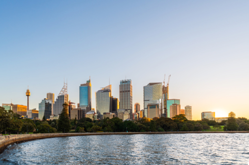 Vibrant Sydney City skyline embracing the golden hues of sunset - Australian Stock Image